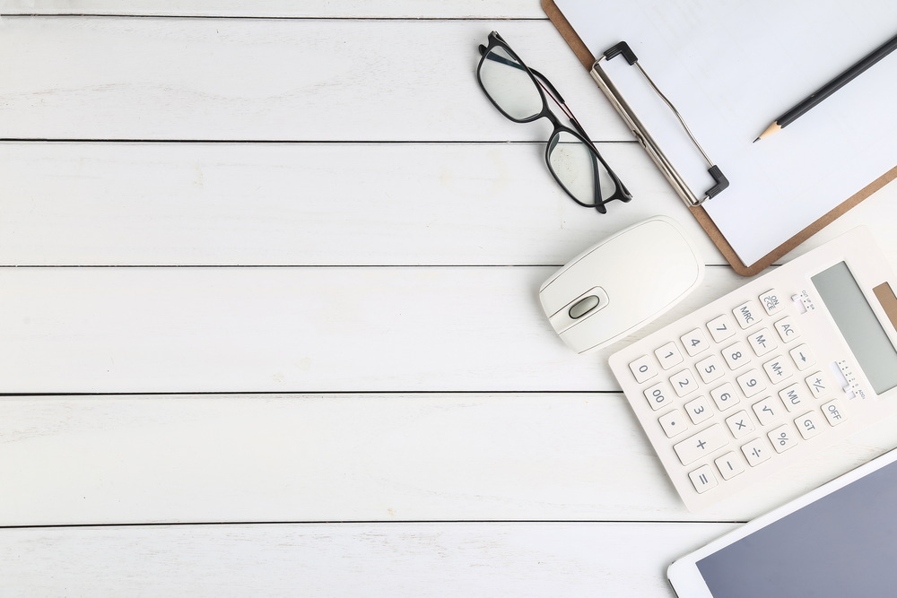 glasses-calculator-tablet-white-neat-desk-1.jpg